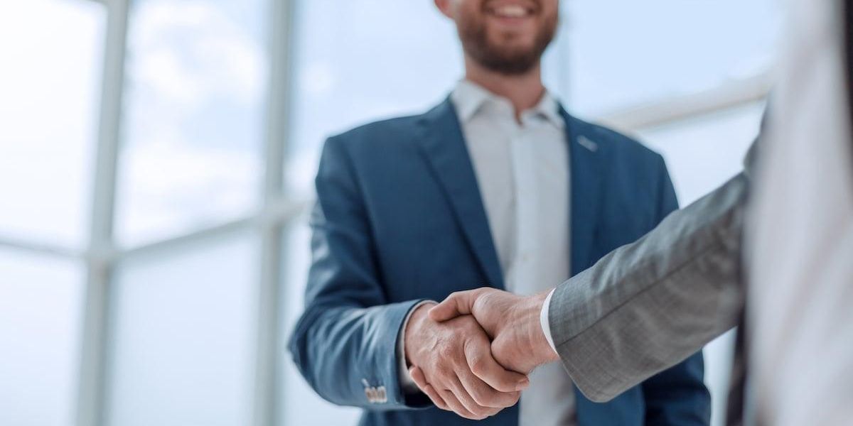 Business partners shaking hands over a decision